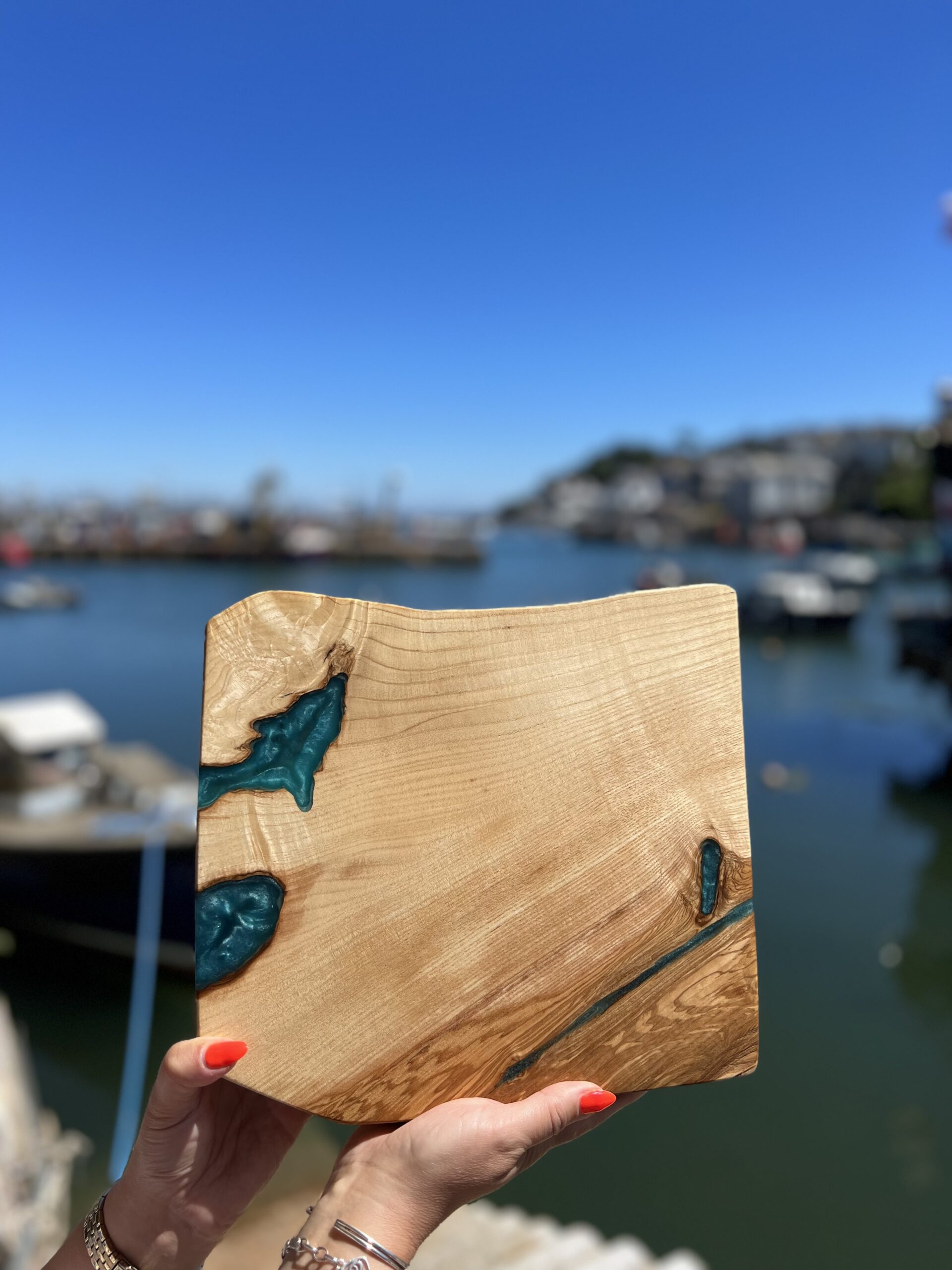Unique, handcrafted natural solid wood serving/chopping board, adorned with stunning full-depth resin pour, functional artwork, made in Brixham, Devon by Mackerel Works