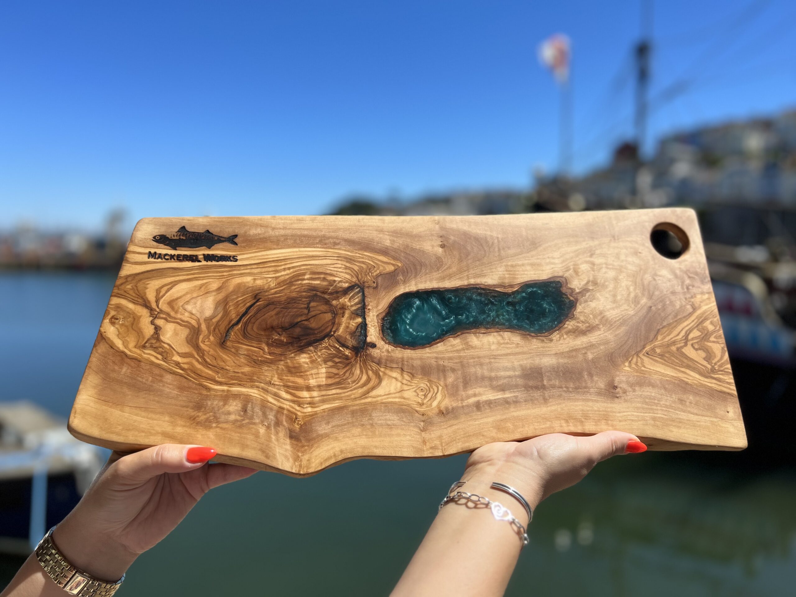 Handcrafted natural solid wood serving/chopping board, adorned with full-depth resin pour, functional artwork, made in Brixham, Devon by Mackerel Works