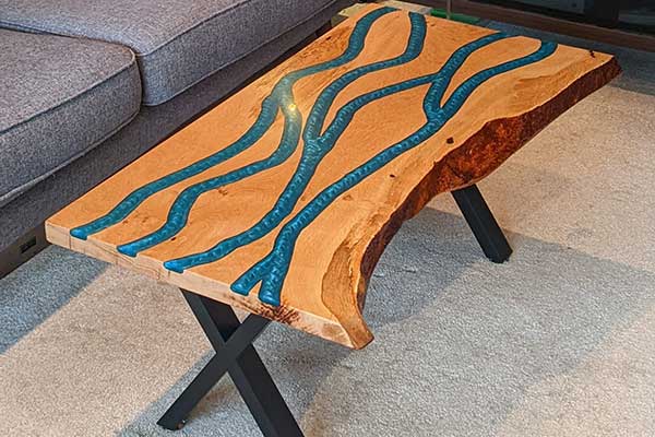 chopping-board-conditioner-closeup Unique, handcrafted natural solid wood coffee table, adorned with stunning full-depth resin pour, functional artwork, made in Brixham, Devon by Mackerel Works